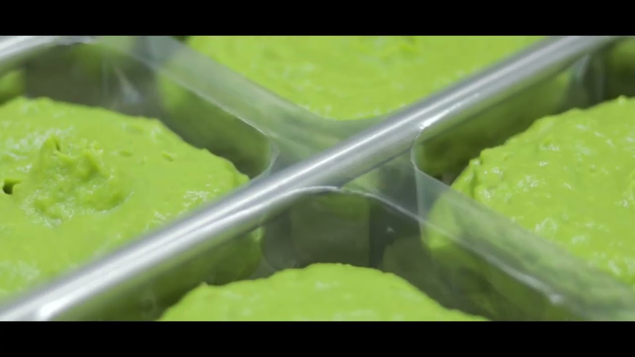 Guacamole pouches moving through the production line